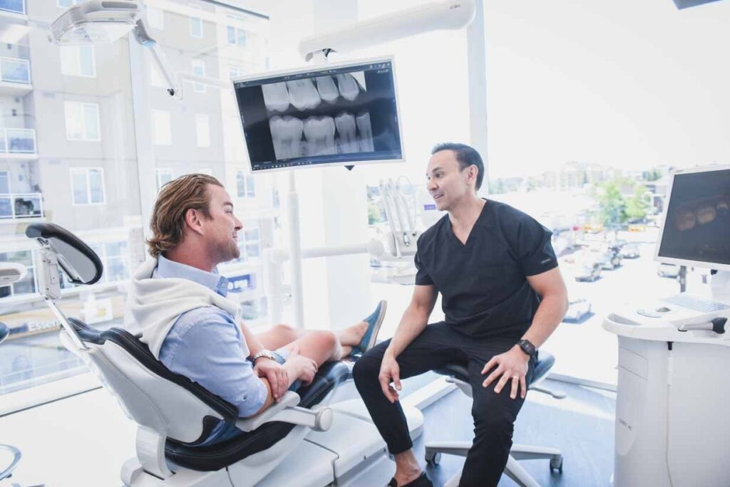 Dentist Chatting with Patient | Odeon Dental | Marda Loop Dentist