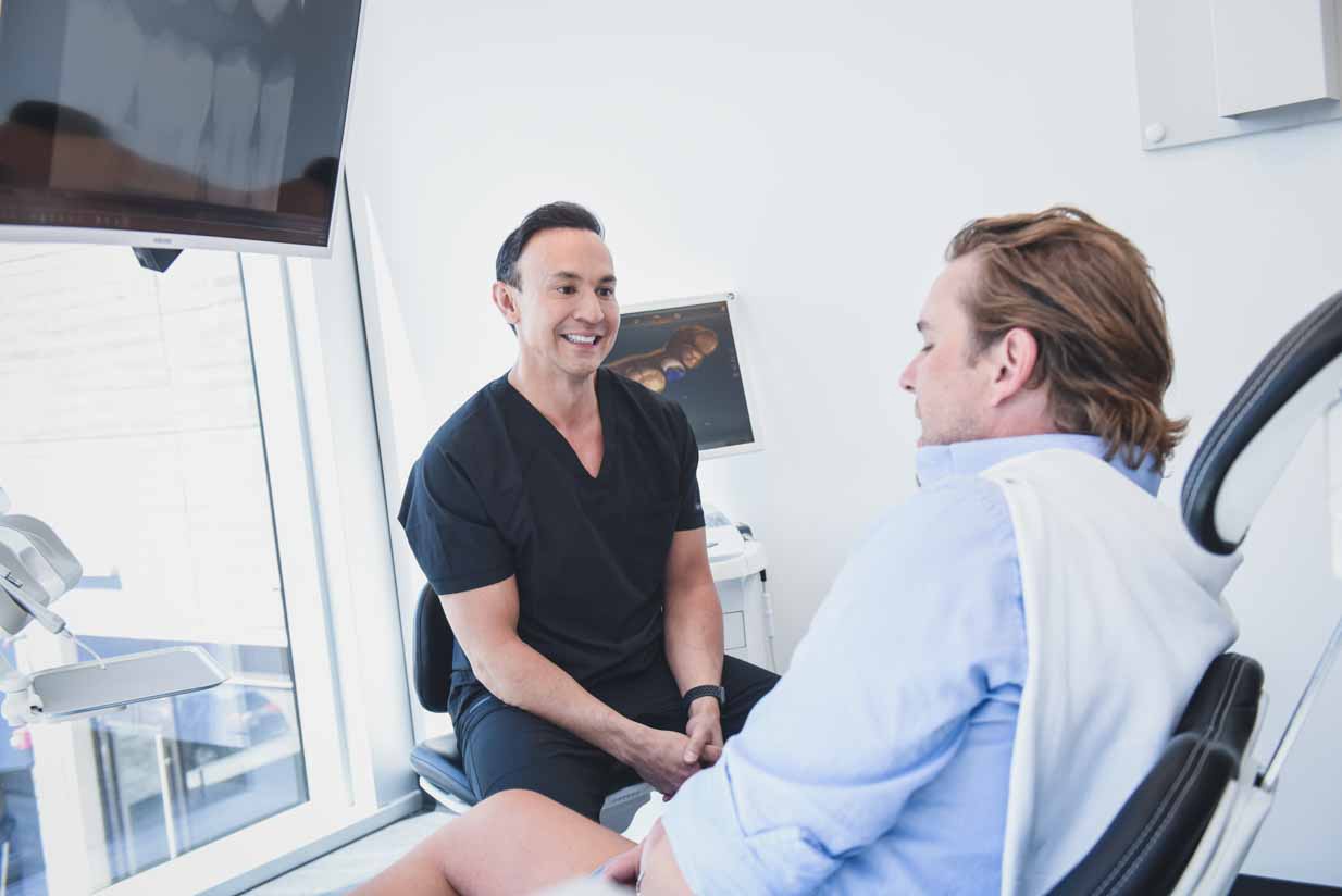 odeon-dental-marda-loop-dentist-patient-consultation Dr. Troy Wakeford Consulting Patient | Odeon Dental | Marda Loop Dentist